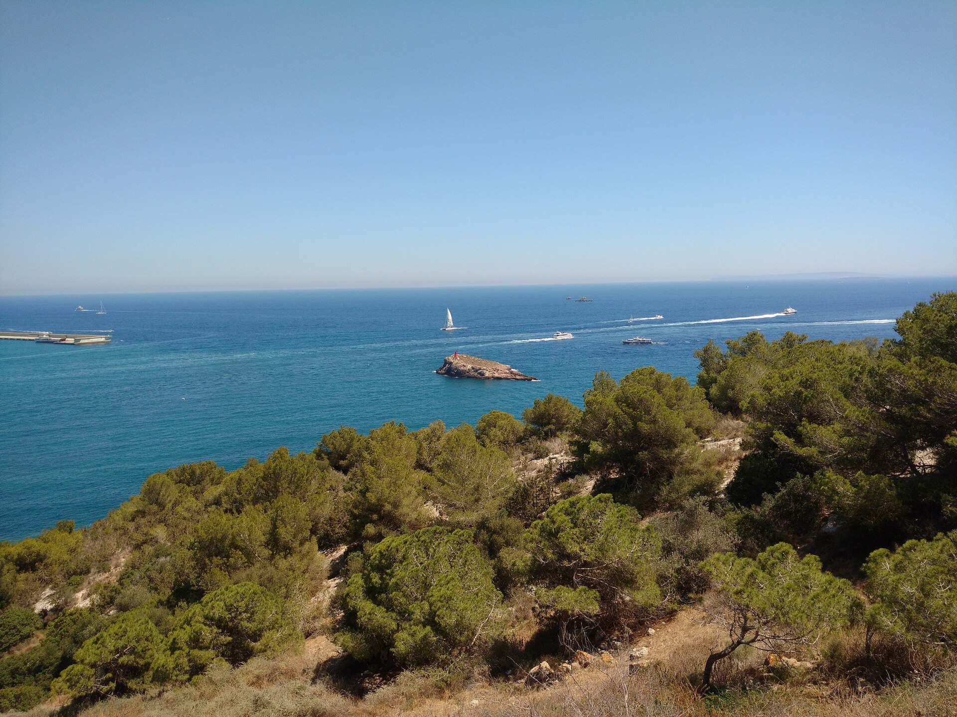 Coastal hiking trail to a hidden beach in Ibiza